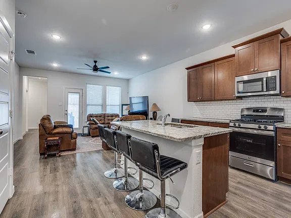 Kitchen and open living area at Garland Home